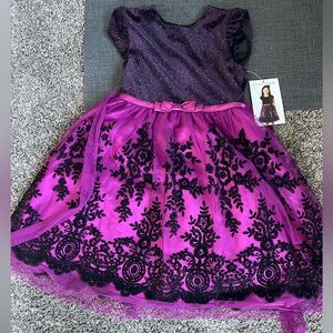 Never worn! The color is a bit plum not pink as showing in photo.